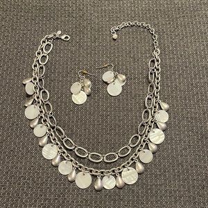 Cute necklace with matching earrings.